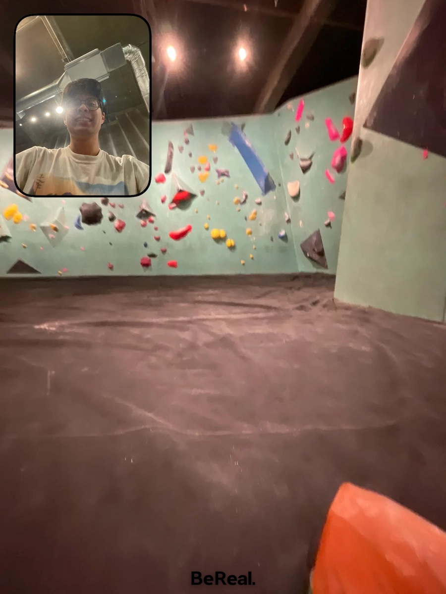 a selfie and rearfacing view of indoor rock climbing walls